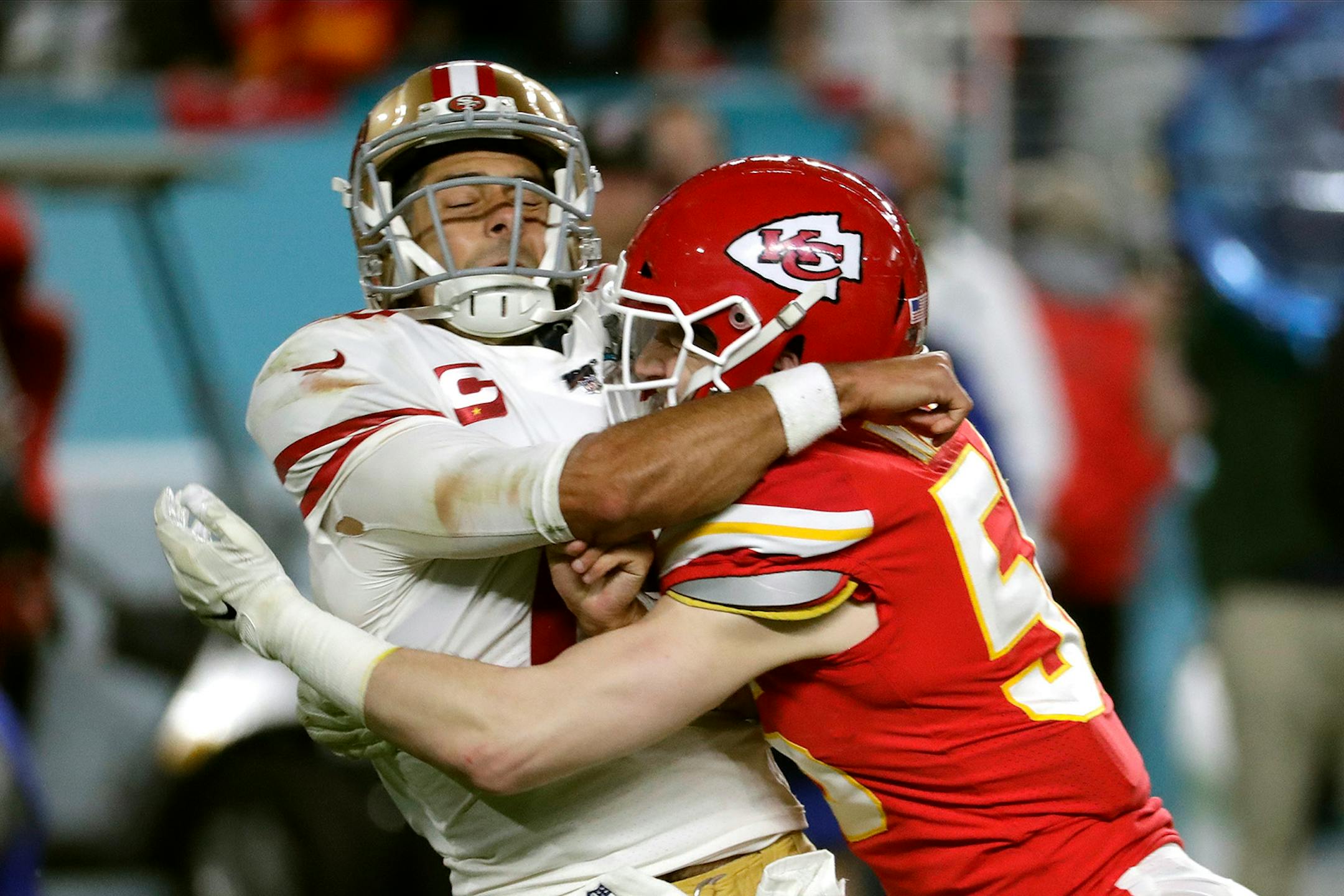 Kansas City Chiefs linebacker Ben Niemann, right, hits San Francisco 49ers quarterback Jimmy Garoppolo during the second half of the NFL Super Bowl 54 football game Sunday, Feb. 2, 2020, in Miami Gardens, Fla.