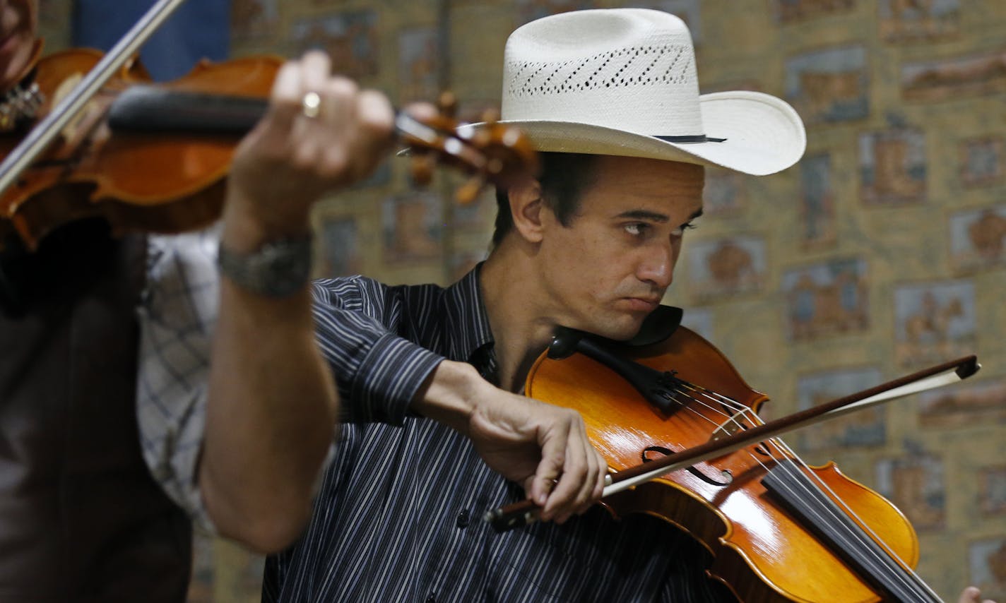 At the Open Range Cowboy Church in Isanti, a cincello player is part of the band. ] tsong-taataarii@startribune.com