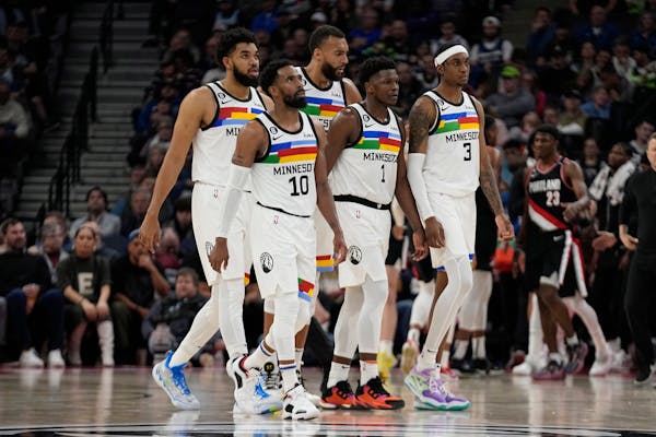 From left to right, Minnesota Timberwolves center Karl-Anthony Towns, guard Mike Conley, center Rudy Gobert, guard Anthony Edwards (1) and forward Jad