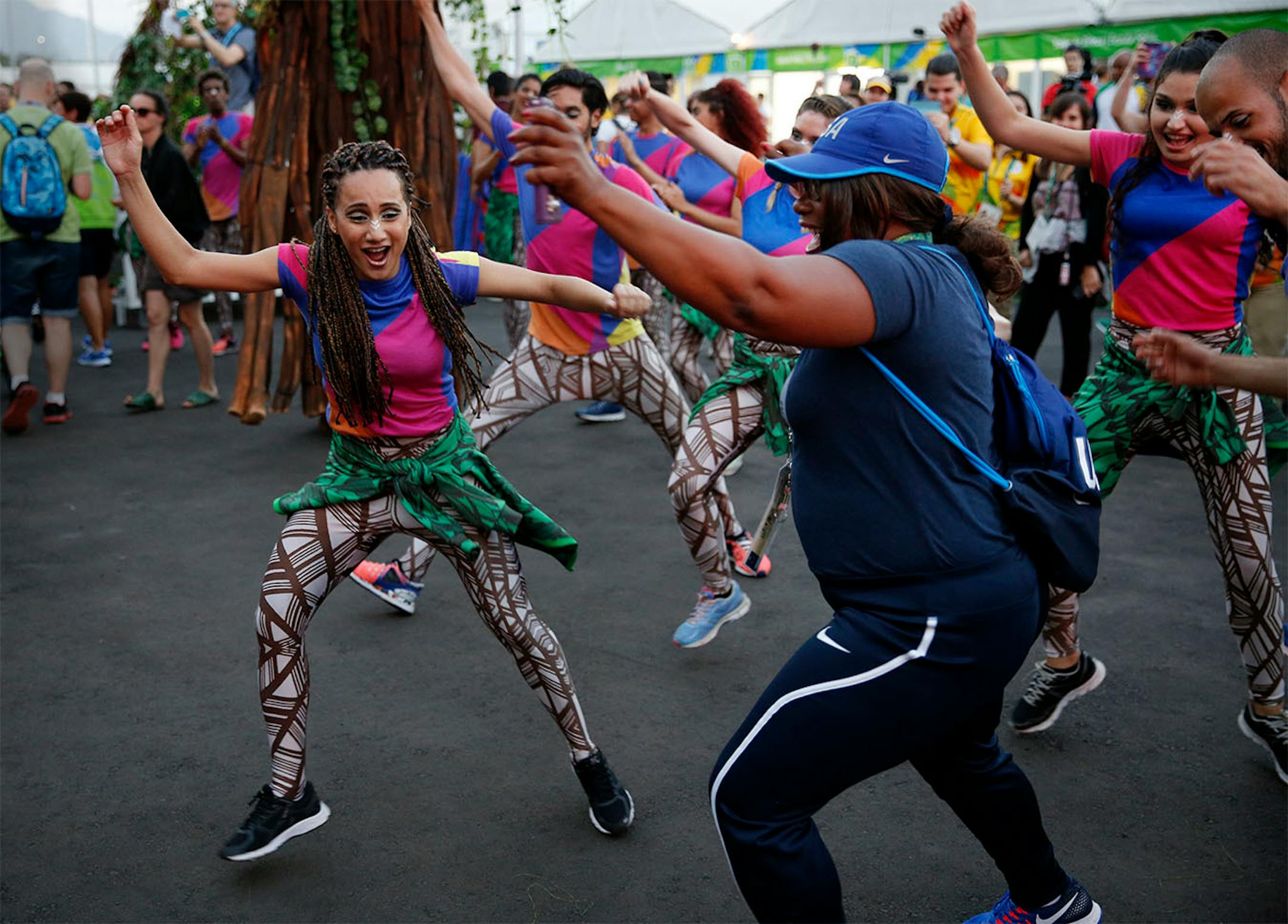 The American flag was raised in the Olympic Athlete Village Thursday afternoon during a welcome ceremony. Athletes were greeted by Brazilian dancers who entertained the crowd.