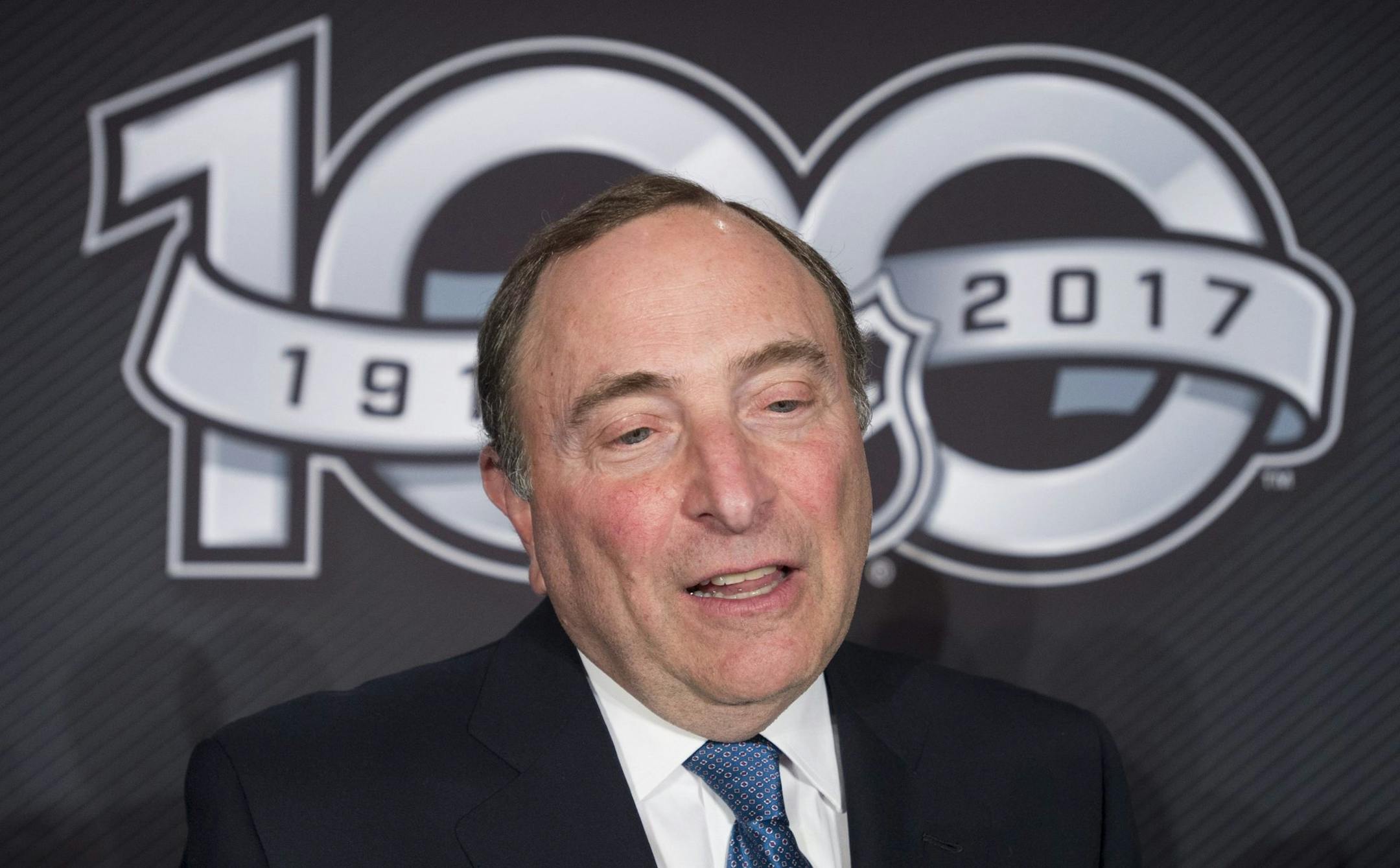 FILE - This March 17, 2017 file photo shows NHL Commissioner Gary Bettman speaking with the media following a news conference in Ottawa. The NHL announced Monday, April 3, 2017 that it will not participate in the 2018 Winter Olympics in South Korea, saying it sees no tangible benefit in halting its season for three weeks next February despite clear signs from the world's best players that they want to go. (Adrian Wyld/The Canadian Press via AP, file)