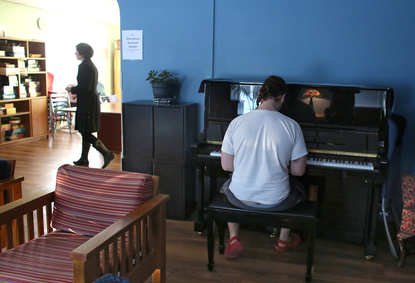 A homeless youth played piano in a common room at Avenues. ] (KYNDELL HARKNESS/STAR TRIBUNE) kyndell.harkness@startribune.com At Avenues for Homeless Youth Minneapolis, MN Thursday, February 27, 2014. ORG XMIT: MIN1403141553130111