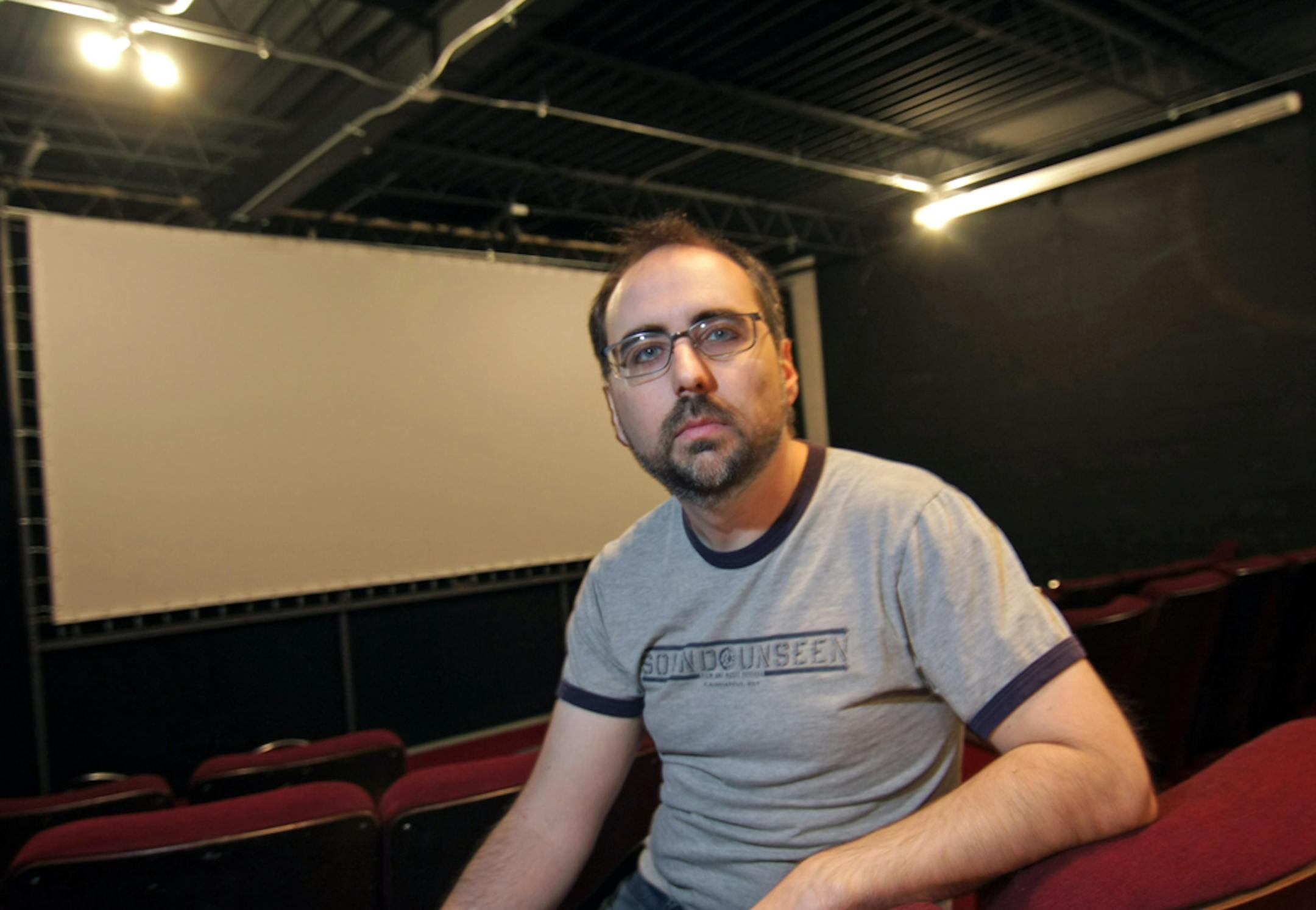 Barry Kryshka in his Trylon Microcinema.