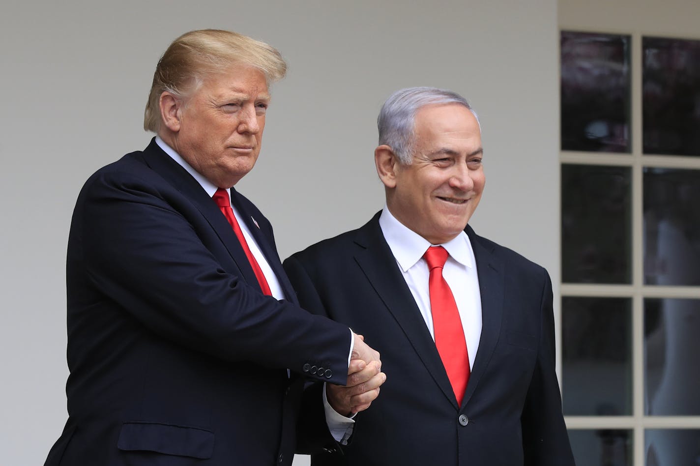 FILE - In this March 25, 2019 file photo, President Donald Trump welcomes visiting Israeli Prime Minister Benjamin Netanyahu to the White House in Washington. In the eyes of critics, Benjamin Netanyahu&#x2019;s decision to bar two Democratic congresswomen at the request of President Donald Trump is the latest reckless gamble by a prime minister willing to sacrifice Israel&#x2019;s national interests for short-term gain. And yet the pursuit of such allegedly short-term gains has kept Netanyahu in