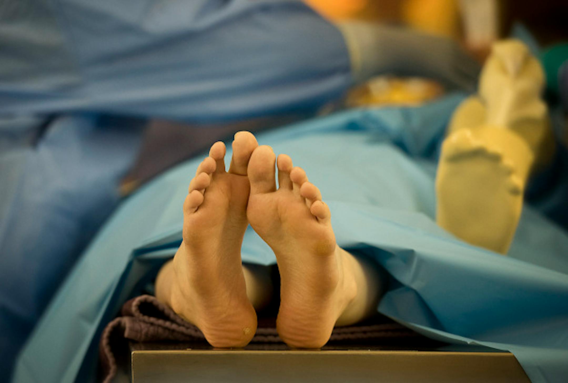 The mock patient was draped and prepared by surgical technologists who graduated from the Rasmussen College program last June.  Surgical technologists and surgical technology students participated in a mock knee replacement procedure in the Great Hall of the Capitol Thursday, April 11, 2013 to bring attention to to bills that would ensure standards for the now unregulated profession.      ]   GLEN STUBBE * gstubbe@startribune.com