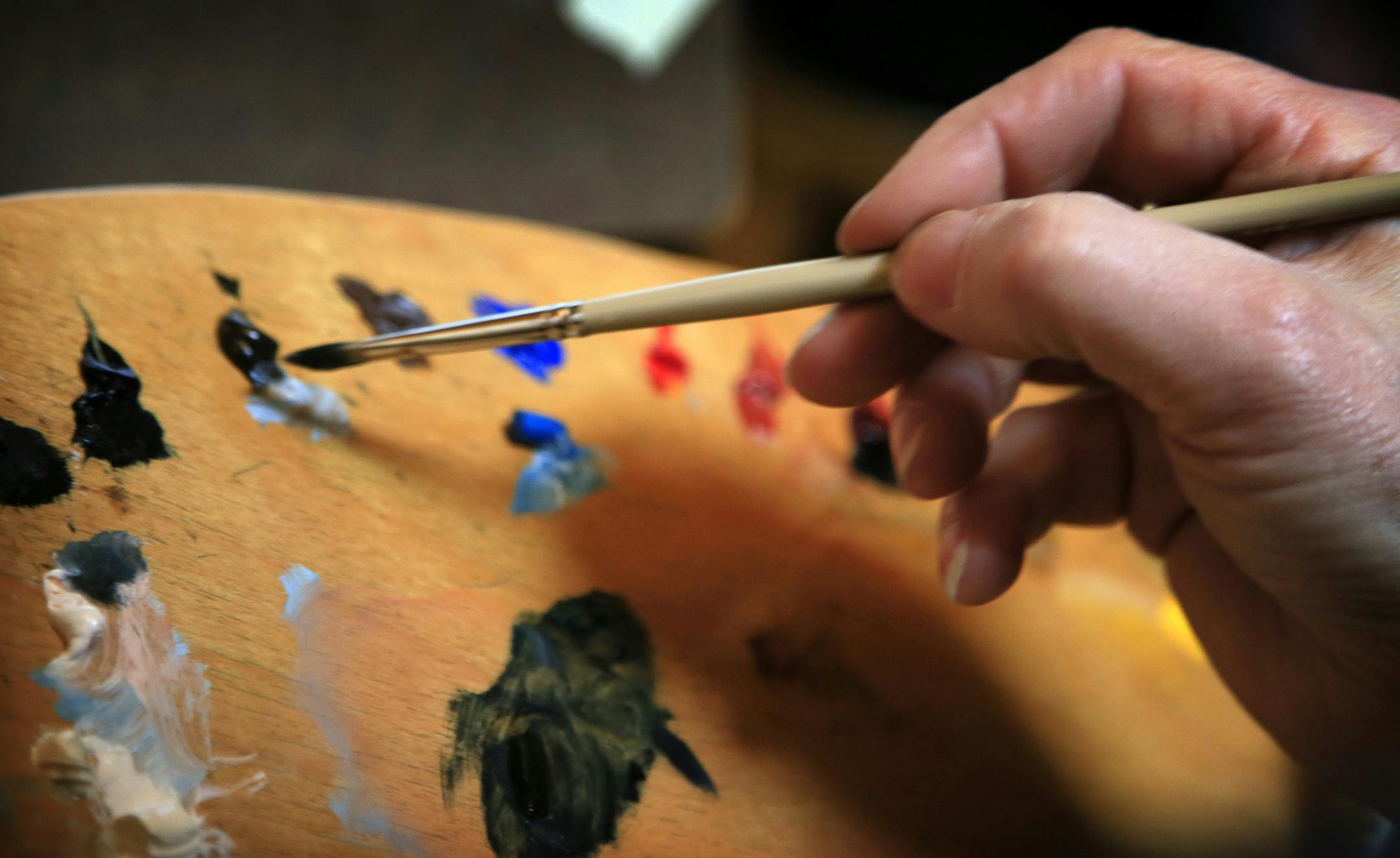 Ray Stumpf, a Navy veteran and retired school teacher is dying of cancer, he is spending his final months decked out in naval gear and sitting as the model for "the lone sailor" in one of Charles Kapsner's military paintings. Here, Kapsner mixes paint to get just the right Indego Blue for Stumpf's uniform. ] BRIAN PETERSON &#x2022; brianp@startribune.com
Little Falls, MN - 02/27/2012