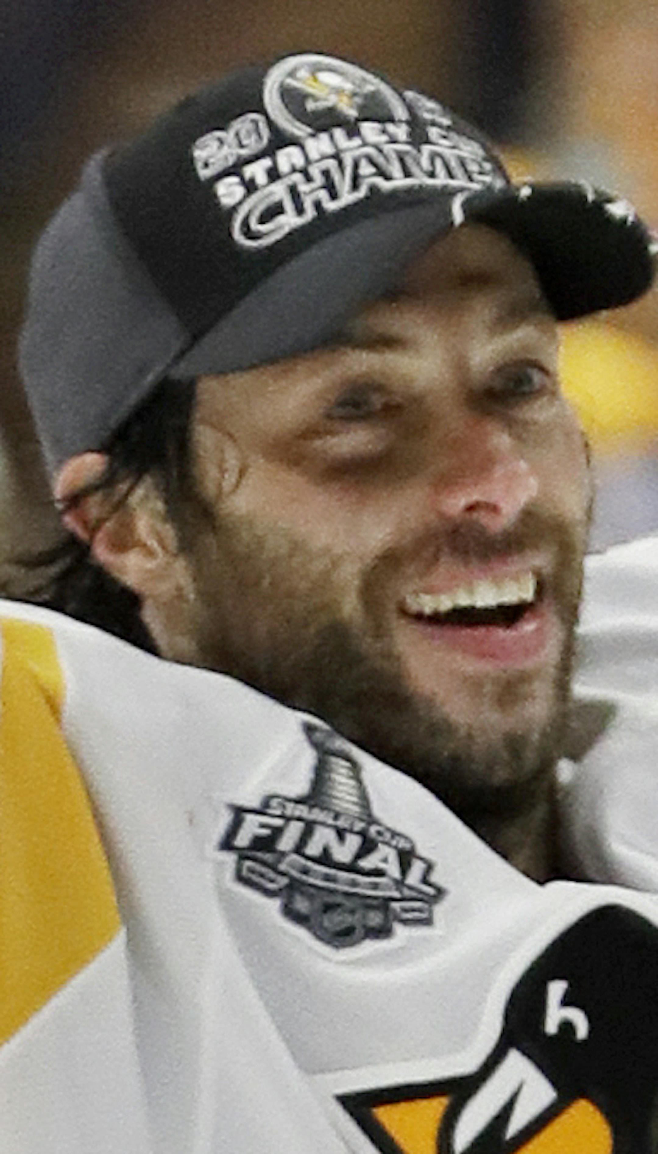 Pittsburgh Penguins center Matt Cullen celebrates with the Stanley Cup after the Penguins defeated the Nashville Predators 2-0 in Game 6 of the NHL hockey Stanley Cup Finals Sunday, June 11, 2017, in Nashville, Tenn. (AP Photo/Mark Humphrey) ORG XMIT: TNMH1