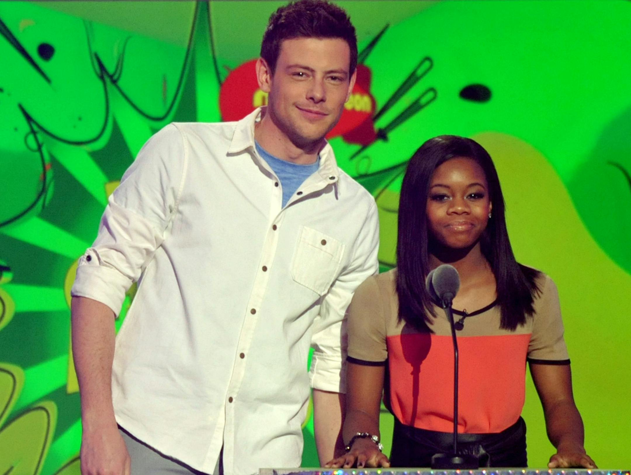 Cory Monteith, left, and Gabby Douglas present the award for favorite male athlete at the 26th annual Nickelodeon's Kids' Choice Awards on Saturday, March 23, 2013, in Los Angeles. (Photo by John Shearer/Invision/AP)