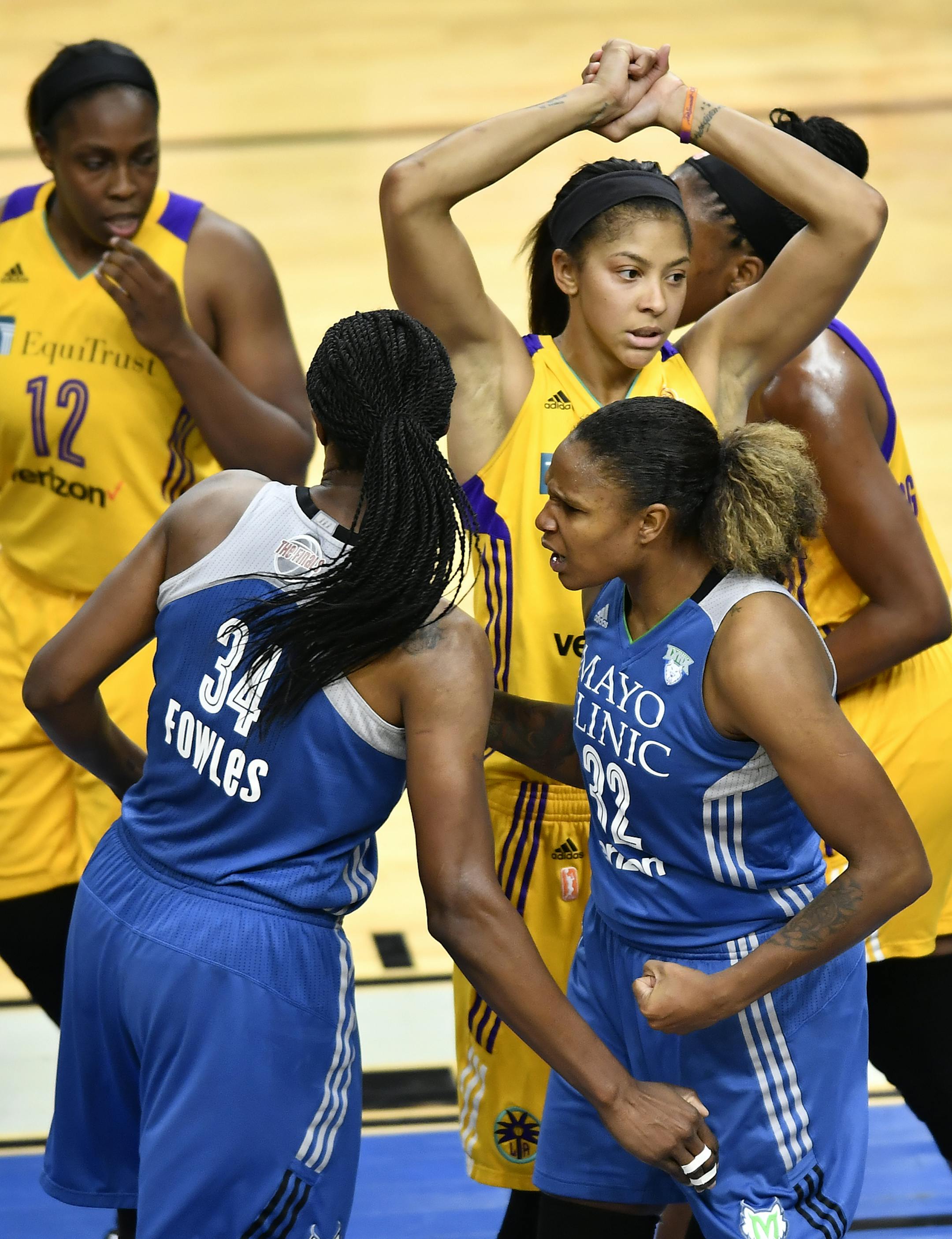 Minnesota Lynx forward Rebekkah Brunson (32) and center Sylvia Fowles (34) celebrated after Brunson was fouled during a shot late in the fourth quarter. ] (AARON LAVINSKY/STAR TRIBUNE) aaron.lavinsky@startribune.com The Minnesota Lynx play the Los Angeles Sparks in game five of the WNBA championships on Thursday, Oct. 20, 2016 at Target Center in Minneapolis, Minn.