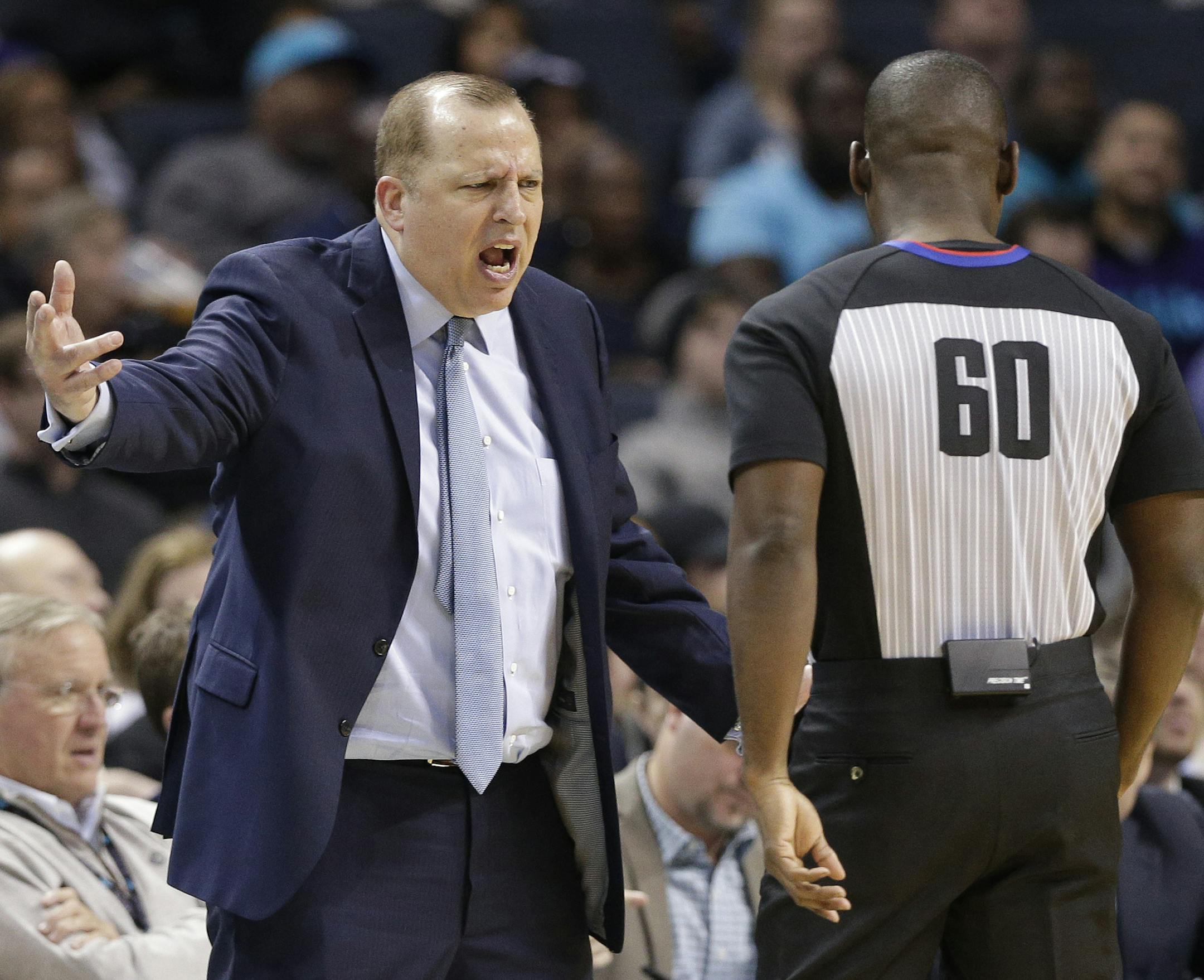 Minnesota Timberwolves head coach Tom Thibodeau, left, argues a call during the second half of an NBA basketball game against the Charlotte Hornets in Charlotte, N.C., Monday, Nov. 20, 2017. (AP Photo/Chuck Burton)