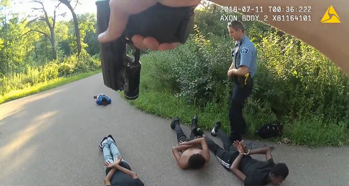 Body camera footage shows Minneapolis Park Police officer Matthew Ryan detain four Somali teens at gunpoint while his partner Eric Olson handcuffs them. The Park Board paid a $170,000 settlement for the incident, which also led to a two-day suspension for Ryan.