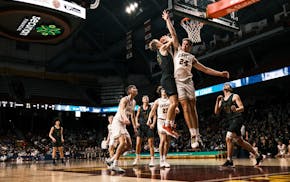 New Life Academy and Sacred Heart players clashed under the basket during the 2023 quarterfinals.