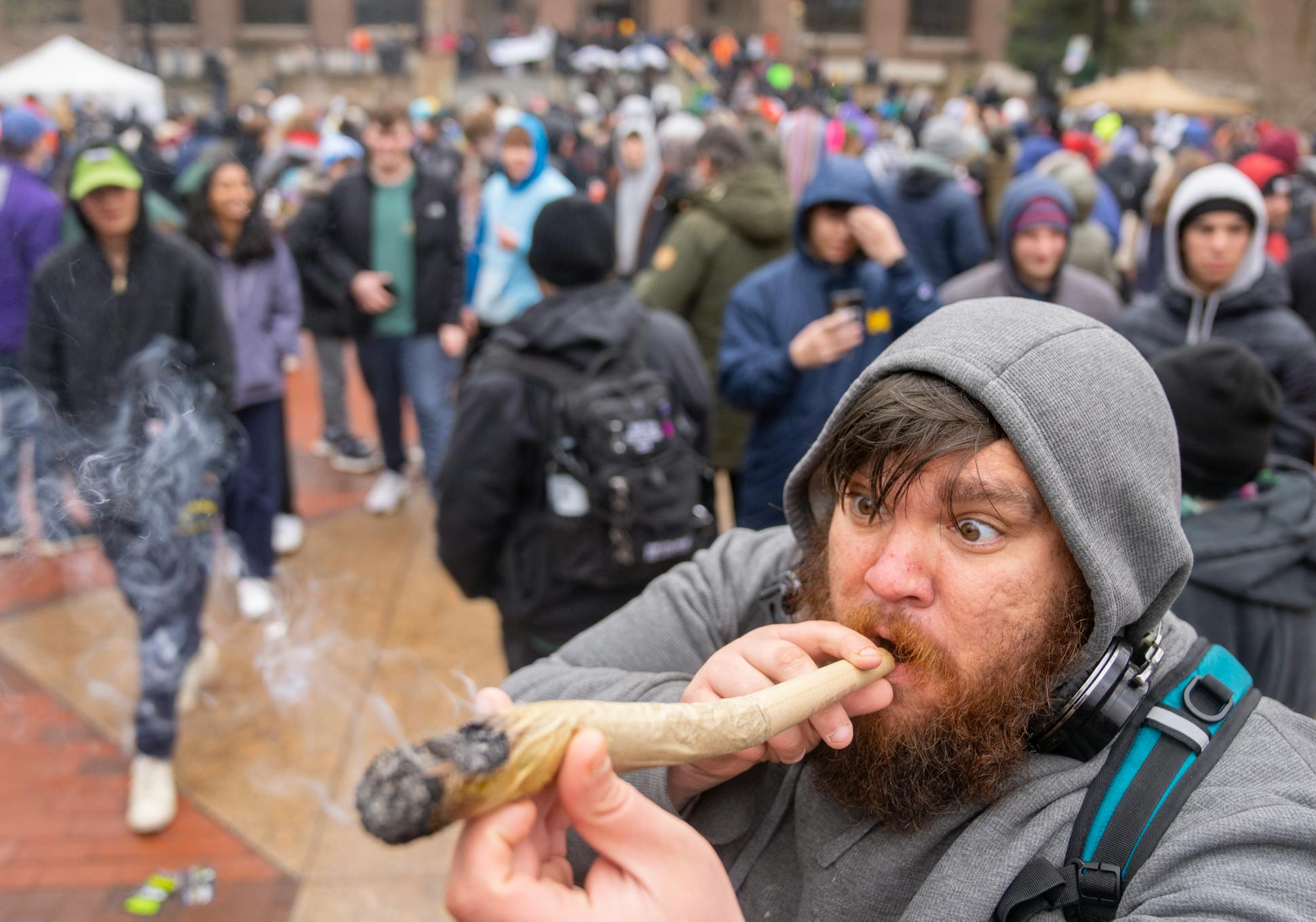 Jonathan “Hagrid” Weddle takes a hit off an 18-inch joint during Hash Bash on the University of Michigan campus in Ann Arbor on April 1. The annual pot party and political rally celebrated marijuana legalization's trailblazing activists this year.