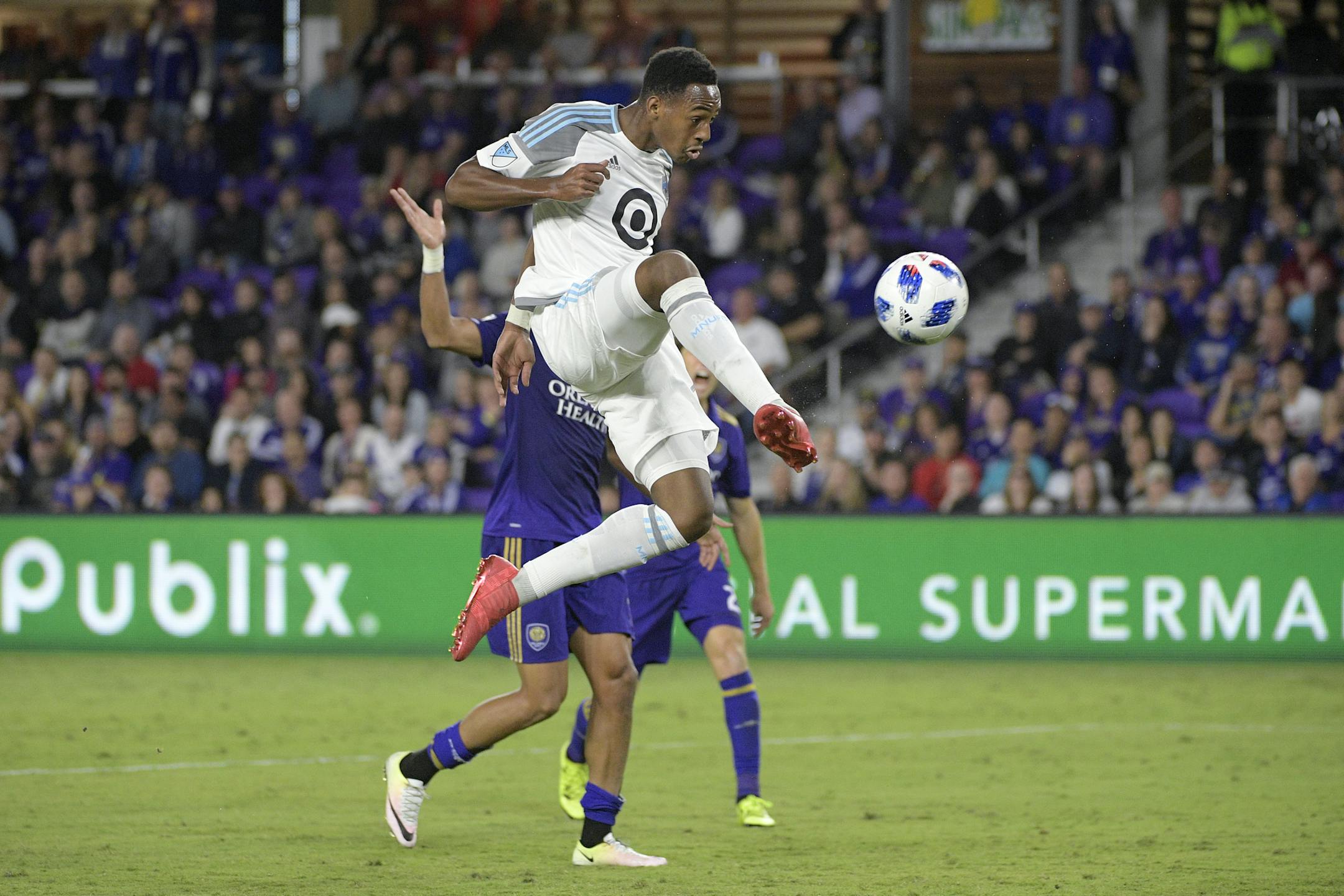 Minnesota United forward Mason Toye attempted a shot on goal in front of Orlando City defender Amro Tarek during the second half of an MLS match in March of 2018.