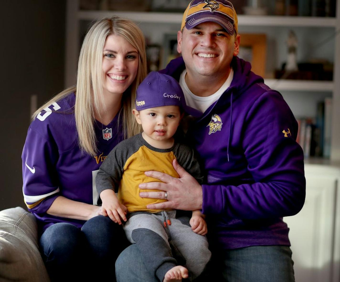 Tomas Cruz and his wife Kyli Cruz are hardcore Vikings fans and season ticket holders and following last Sunday's miracle win over New Orleans they bought tickets for the NFL Championship game in Philadelphia. The Cruz's, seen with their son Crosby, 18 months, were seen at their home Friday, Jan. 19, 2018, in Lakeville, MN.