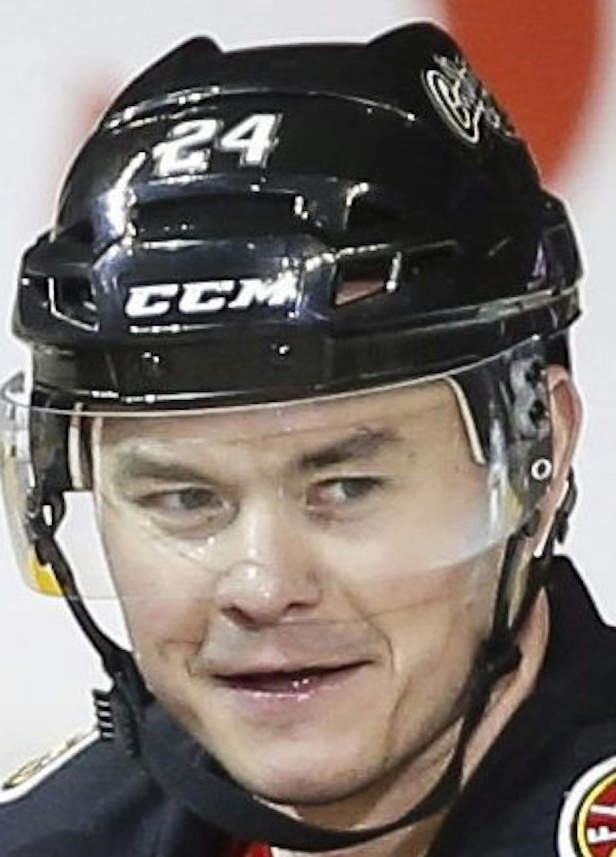 Calgary Flames' Jiri Hudler, right, of the Czech Republic, celebrates his goal with teammate Johnny Gaudreau during the second period of an NHL hockey game against the Toronto Maple Leafs, Friday, March 13, 2015, in Calgary, Alberta. (AP Photo/The Canadian Press, Jeff McIntosh)