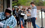 Sixteen DVS exam stations reopened in May, including this one in Arden Hills, where during the midmorning May 19 an estimated 200 people waited outsid