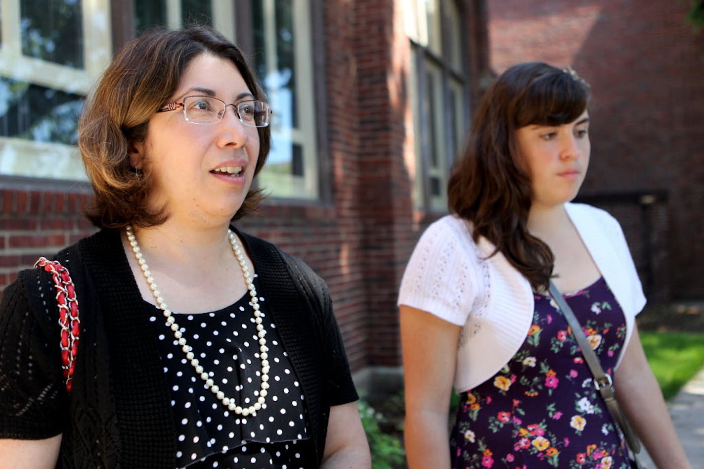 Carolina Anaya-Gennrich and her daughter Carolina Gennrich, of St. Paul, came across the river to mass on Sunday.