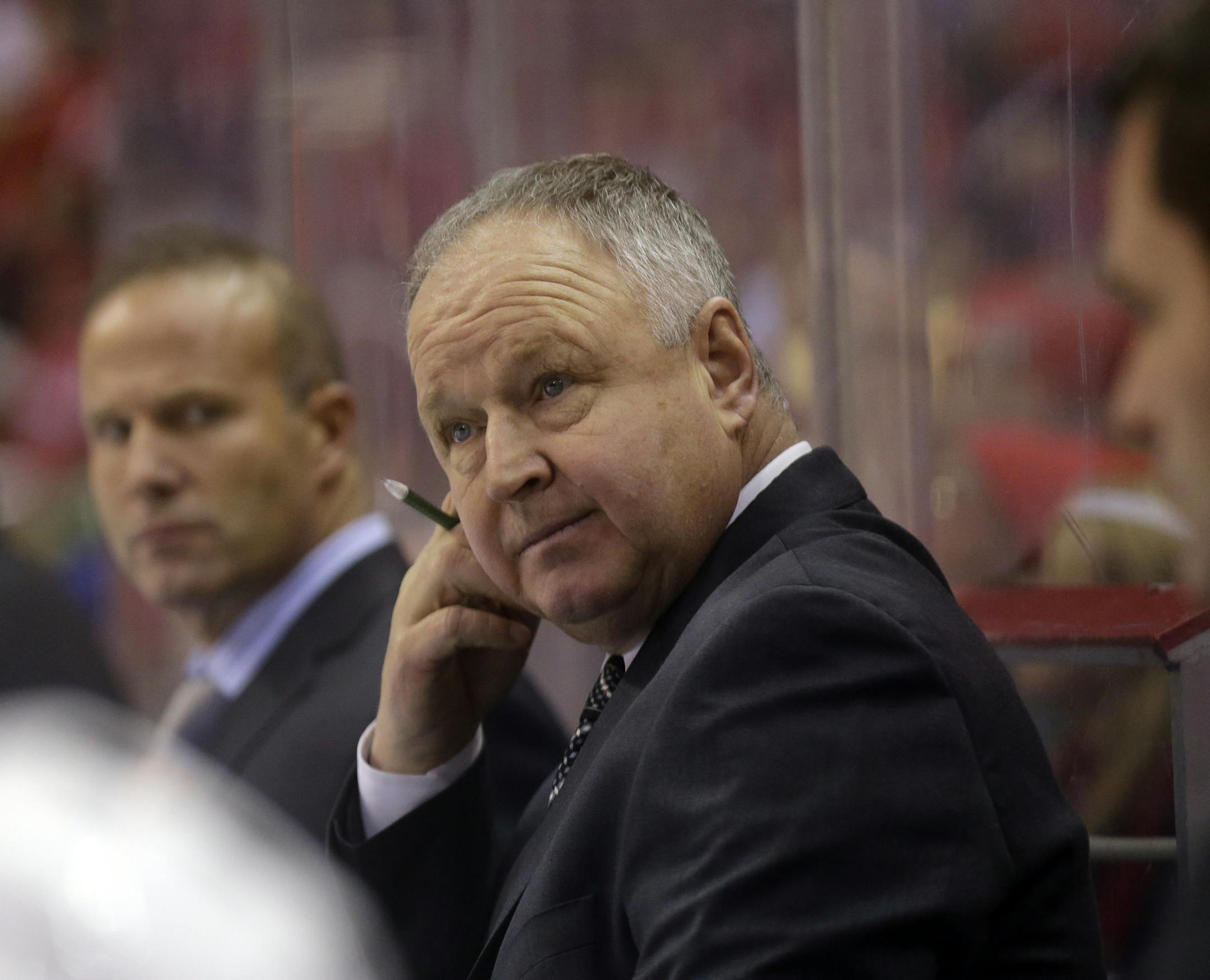 Toronto Maple Leafs head coach Randy Carlyle stands in the bench area in the third period of an NHL hockey game against the Washington Capitals Tuesday, Feb. 5, 2013 in Washington. The Maple Leafs won 3-2. (AP Photo/Alex Brandon) ORG XMIT: VZN10
