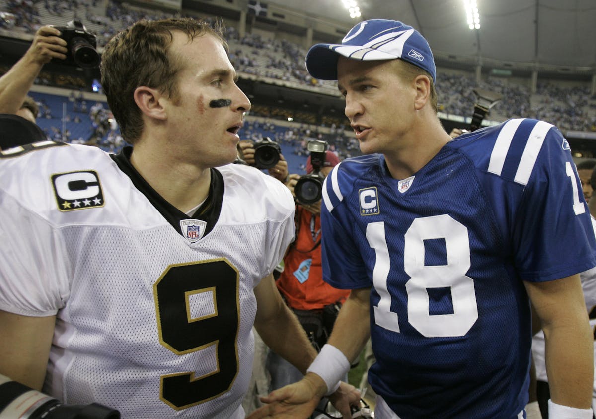 FILE - In this Sept. 6, 2007, file photo, Indianapolis Colts quarterback Peyton Manning, right, and New Orleans Saints quarterback Drew Brees meet aft