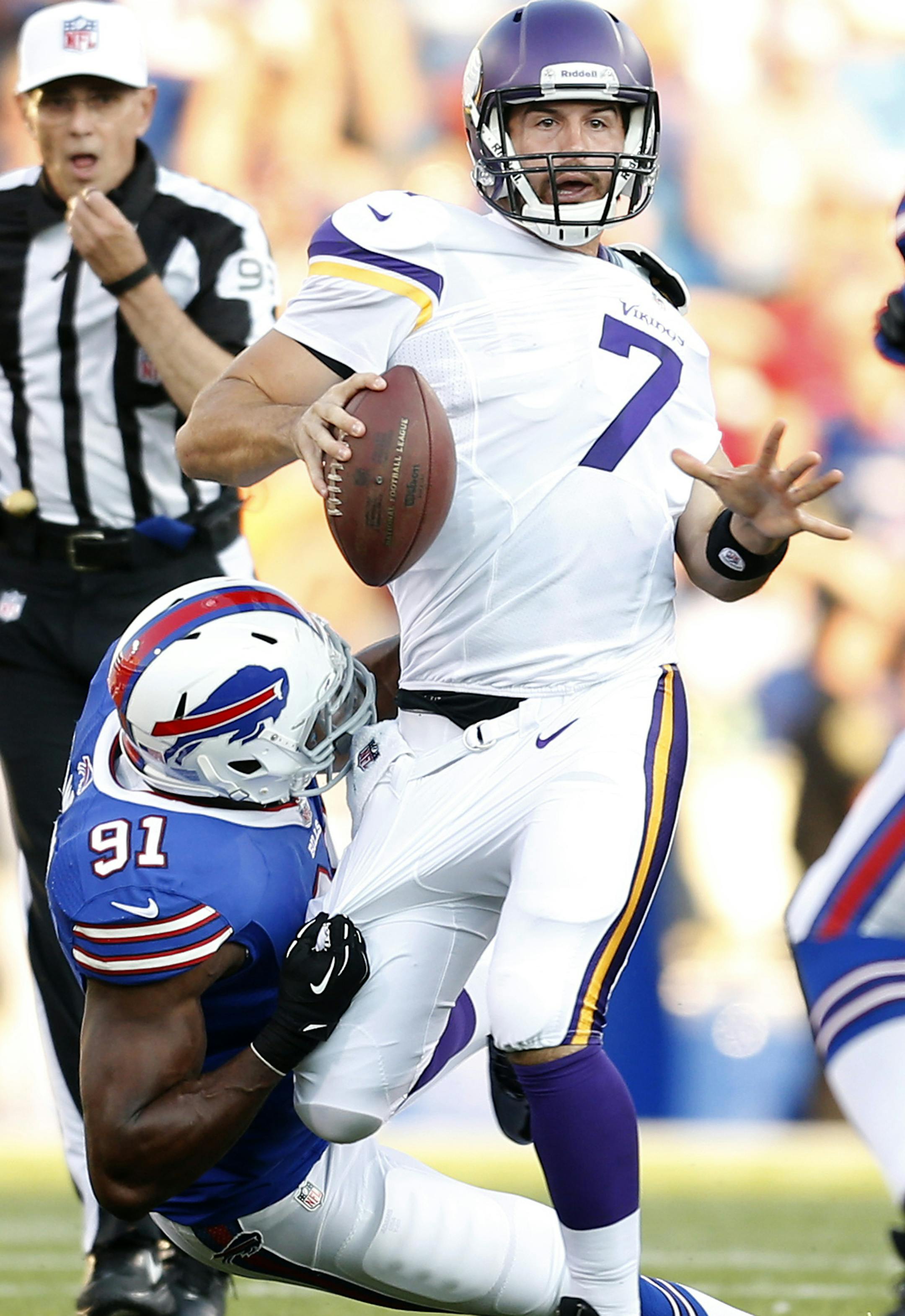 Minnesota Vikings quarterback Christian Ponder (7) was sacked by Manny Lawson (91) in the first quarter. ] CARLOS GONZALEZ cgonzalez@startribune.com August 16, 2013, NFL Ralph Wilson Stadium, Orchard Park, NY Minnesota Vikings vs. Buffalo Bills