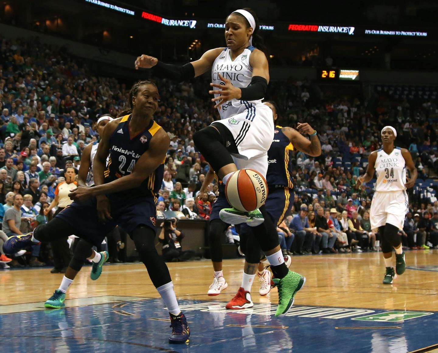 Indiana's Tamika Catchings knocked the ball out of the hands of Lynx' Maya Moore during Game 1.