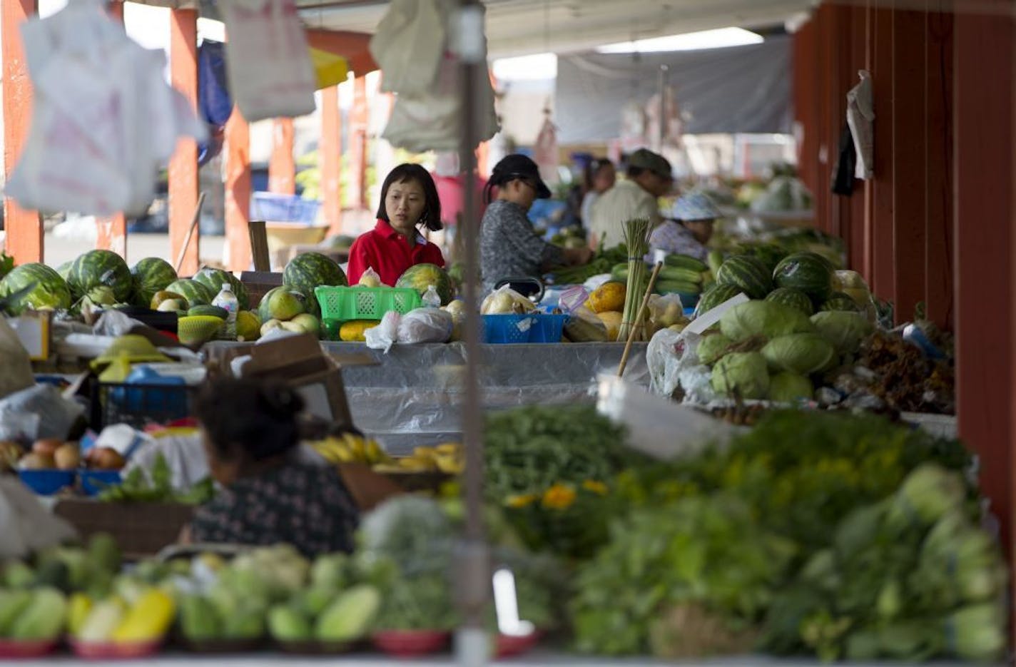 Dozens of vendors line the outdoor farmer's market section of the Hmongtown Market.