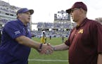 TCU head coach Gary Patterson, left, shakes hands with Minnesota head coach Jerry Kill after their teams played last season.