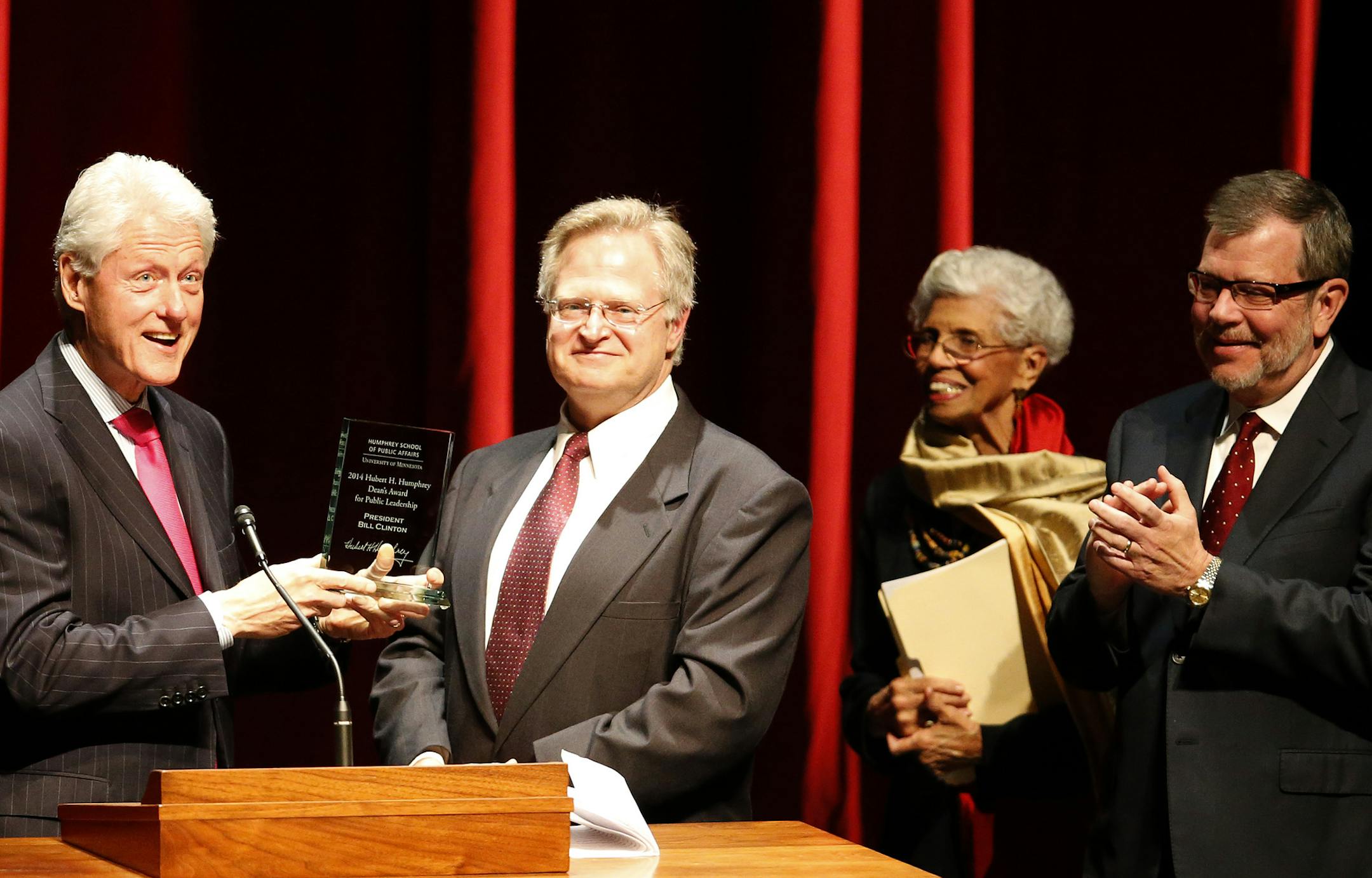 Former President Bill Clinton was presented with the Dean Award for Public Leadership by Eric Schwartz, dean of the Hubert H. Humphrey School of Public Affairs, in Northrop Auditorium at the University of Minnesota on Monday.