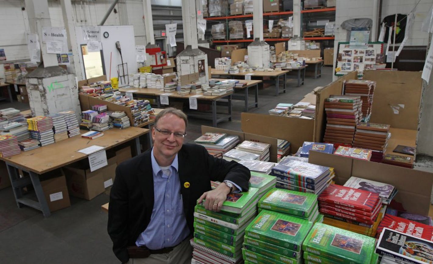 Patrick Pionski, Executive Director of Books for Africa, stood in the book distribution warehouse in St. Paul on 1/3/12.