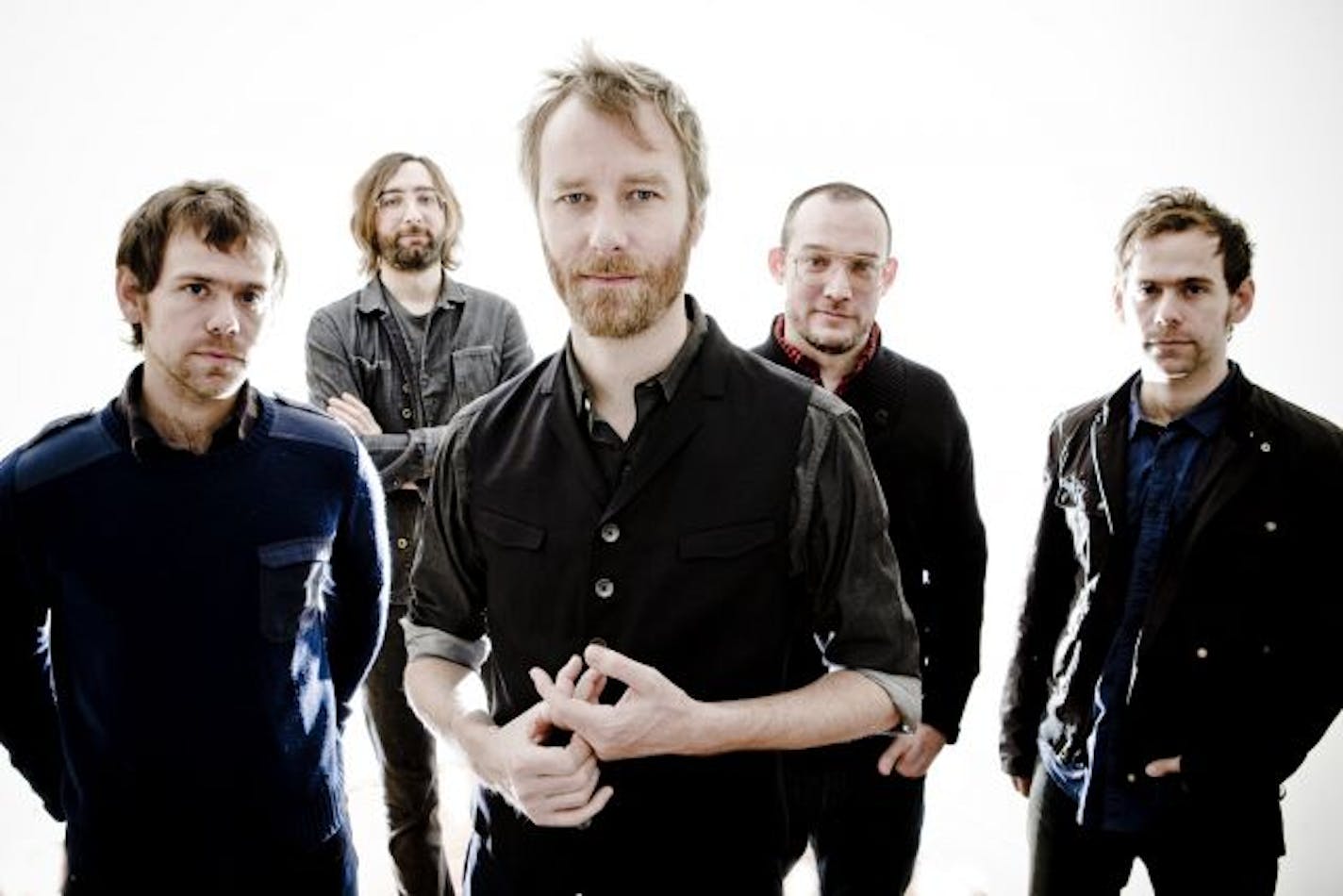 In this publicity image released by 4AD, the band The National, from left, Aaron Dessner, Bryan Devendorf, Matt Berninger, Scott Devendorf, Bryce Dessner are shown.