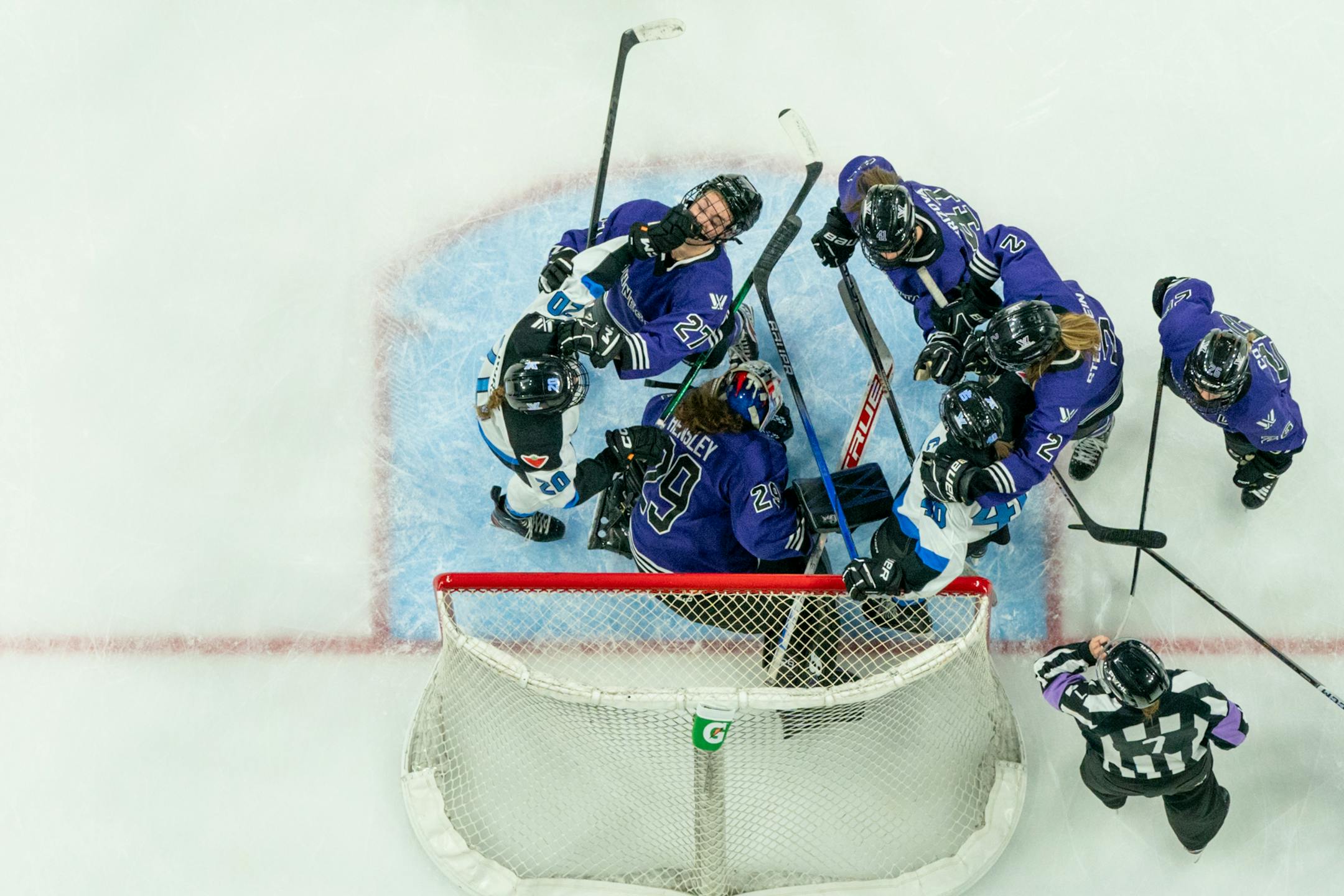 Toronto forward Sarah Nurse (20) and Minnesota forward Taylor Heise (27) pick up roughing penalties after Minnesota goalie Nicole Hensley (29) makes a save at the Xcel Energy Center in St. Paul on Wednesday, Jan. 10, 2024. Photo by Matt Blewett, Special to Star Tribune matt@mattebphoto.com