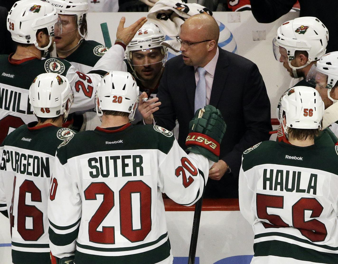 Minnesota Wild head coach Mike Yeo talks to his team during the third period in Game 5 of an NHL hockey second-round playoff series against the Chicago Blackhawks in Chicago,Sunday, May 11, 2014. The Blackhawks won 2-1. (AP Photo/Nam Y. Huh)