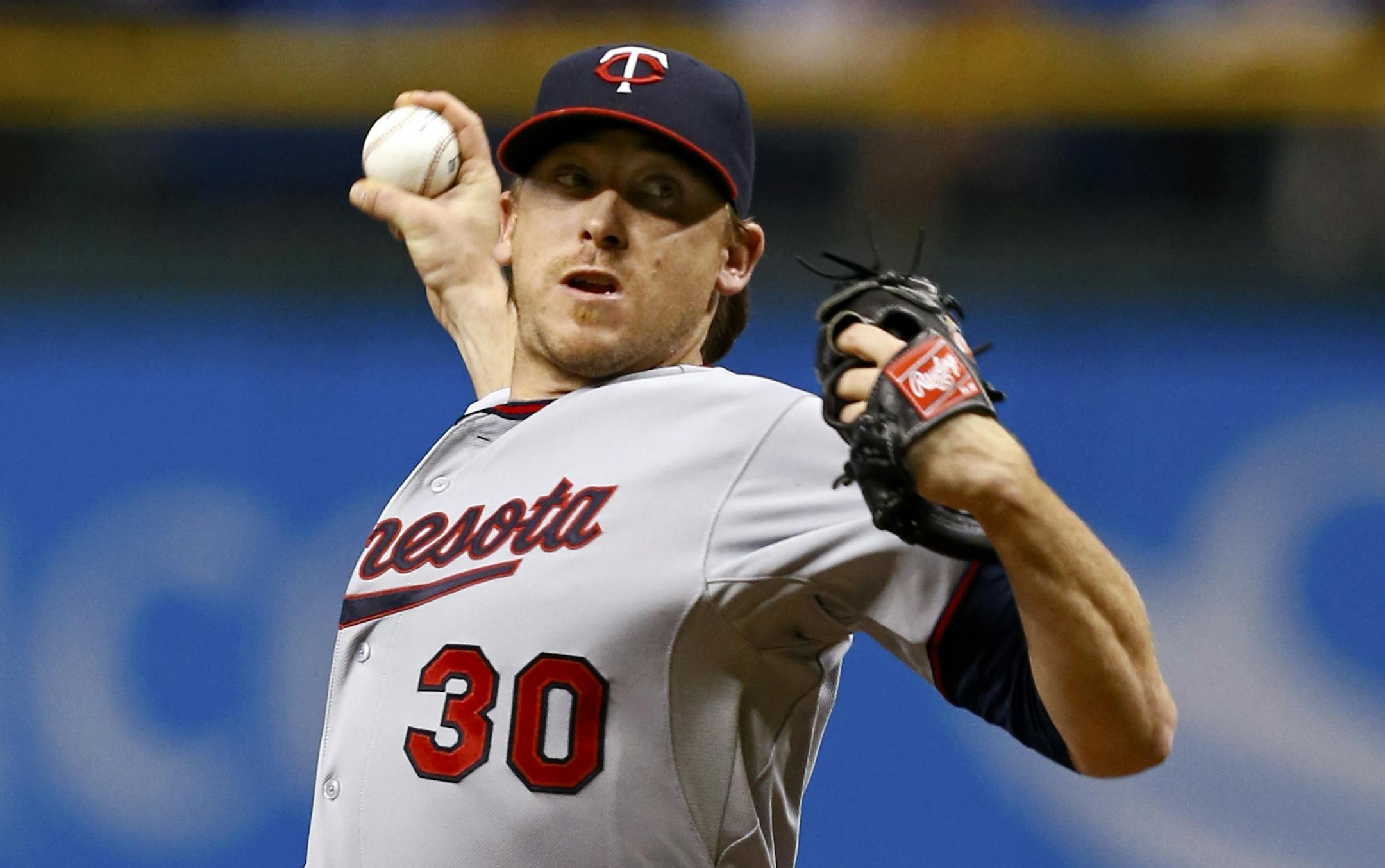 Minnesota Twins starting pitcher Kevin Correia throws during the first inning of a baseball game against the Tampa Bay Rays Wednesday, July 10, 2013, in St. Petersburg, Fla.