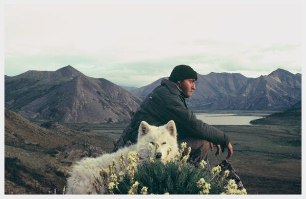 In a self-portrait, Jerry Pushcar of Minnesota, during his canoe odyssey from New Orleans to Nome, Alaska. He is shown with his dog, Vagabond, in nort