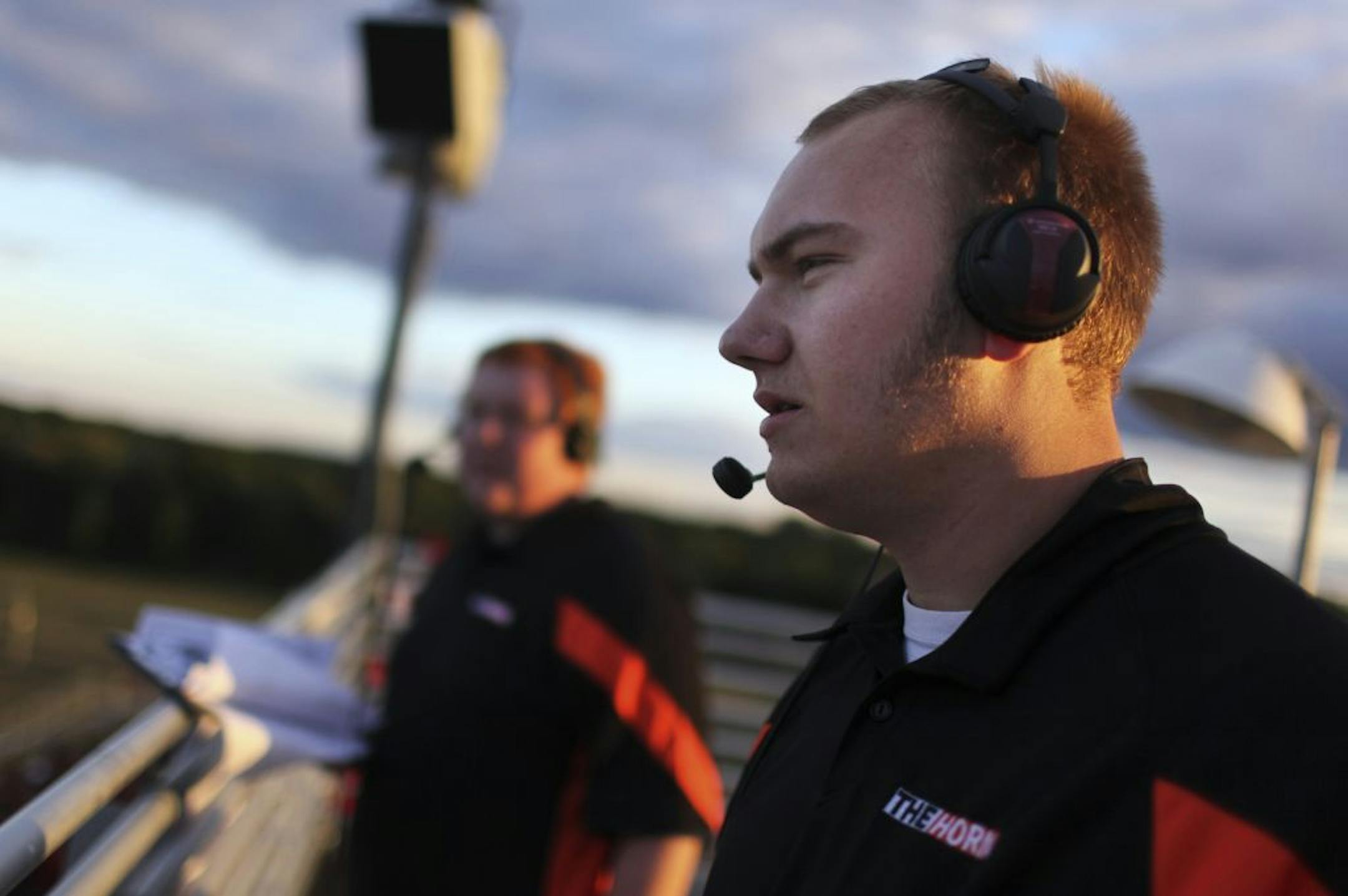 White Bear Lake High School students Zach Halverson, right, and Chad Olson, left, broadcast their team's game with Stillwater High Friday, Sept. 7, 2012, at Stillwater High in Oak Park Heights, MN.