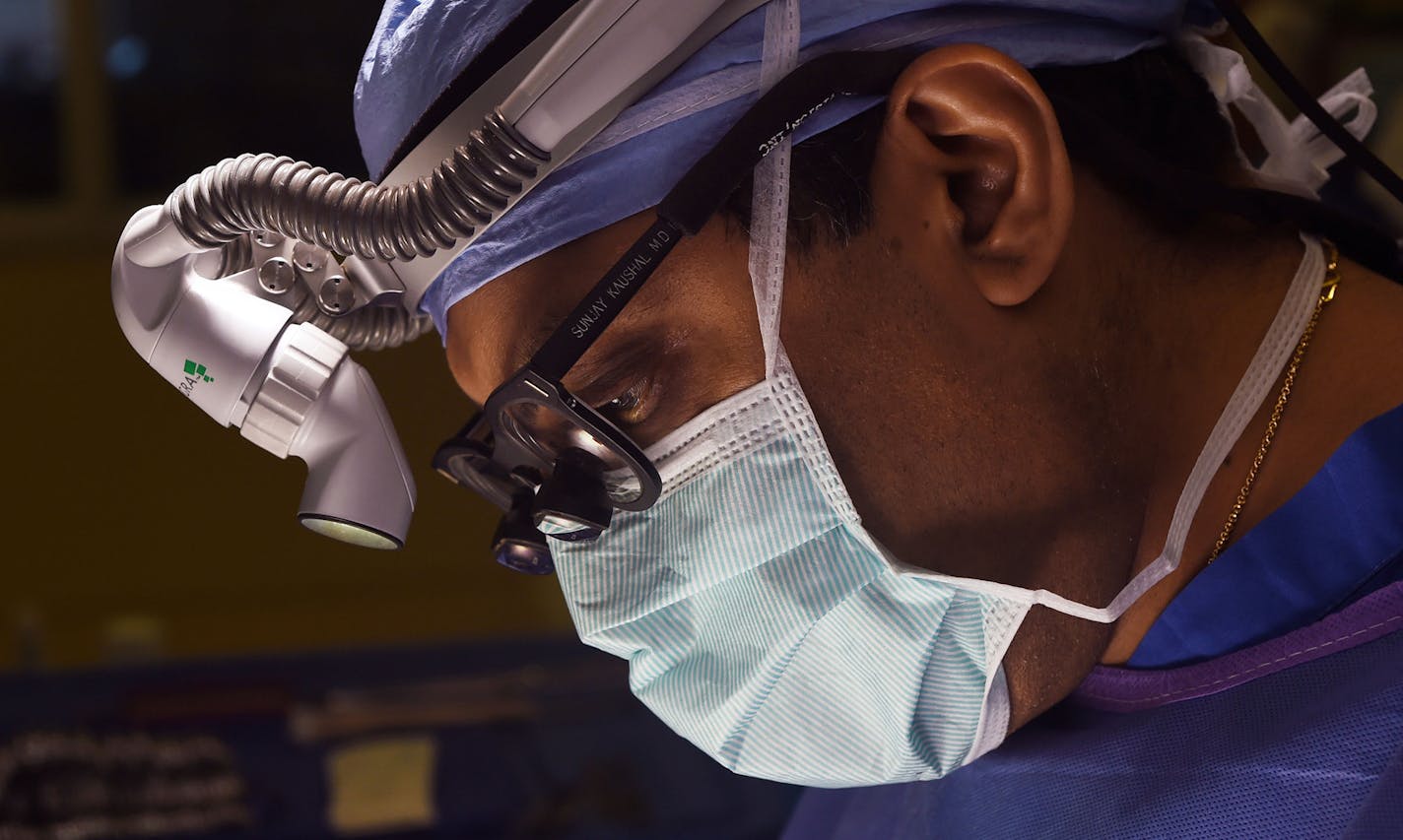 Dr. Sunjay Kaushal performs open heart surgery on Autumn Brown, 4 months old, in a pediatric cardiology operating room at the University of Maryland Children's Hospital.