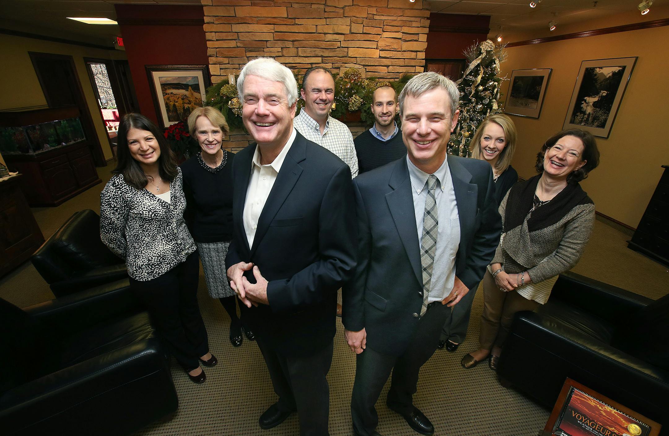 Dan Fazendin, left, and his son Andy Fazendin, right, with their staff at Roger Fazendin Realtors, Wednesday, December 3, 2014 in Wayzata, MN. It is the state's largest independent family owned real estate brokerage, which is in the midst of big changes as the third generation of the company takes over. ] (ELIZABETH FLORES/STAR TRIBUNE) ELIZABETH FLORES • eflores@startribune.com