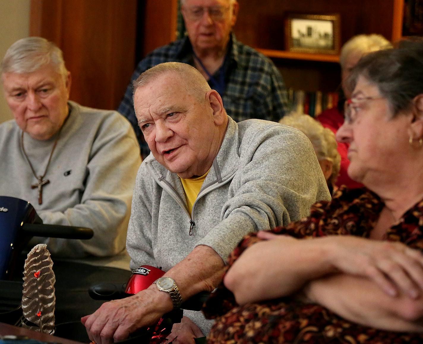 Residents of Autumn Glen Senior Living, including Bill Erickson, left to right, and Jim Nauman, both with limited mobility and using motorized scooters, talk about their fear for the future after a 20 percent or more rent hike they received from management before Christmas. Some have moved out or are in the process because they cannot afford the hikes while others wonder how long they'll be able to afford the rent and when the next hike may be coming Thursday, Feb. 8, 2018, in Coon Rapids, MN.]