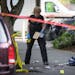 Seattle police investigate the scene after a shooting at Seattle Pacific University on Thursday, June 5, 2014, in Seattle. A lone gunman armed with a 