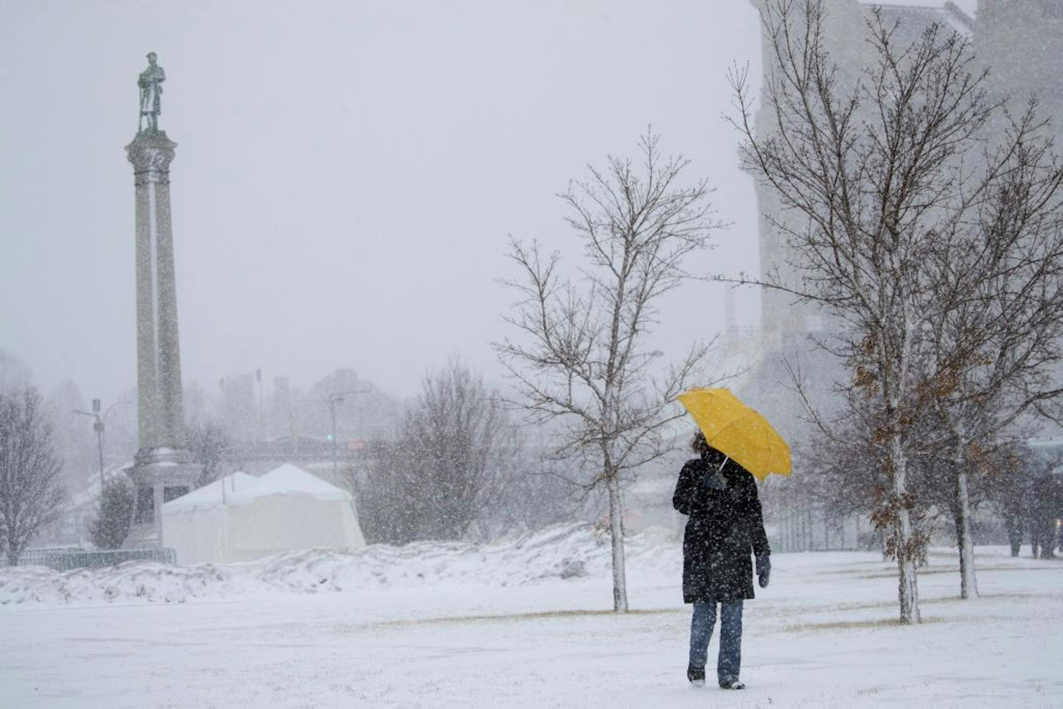 Sarah Wilson walks down the hill along John Ireland boulevard in St. Paul,. Minn., with an umbrella to shield the wind and snow Monday, Jab. 22, 2018. "I walk every day no matter the weather," said Wilson.