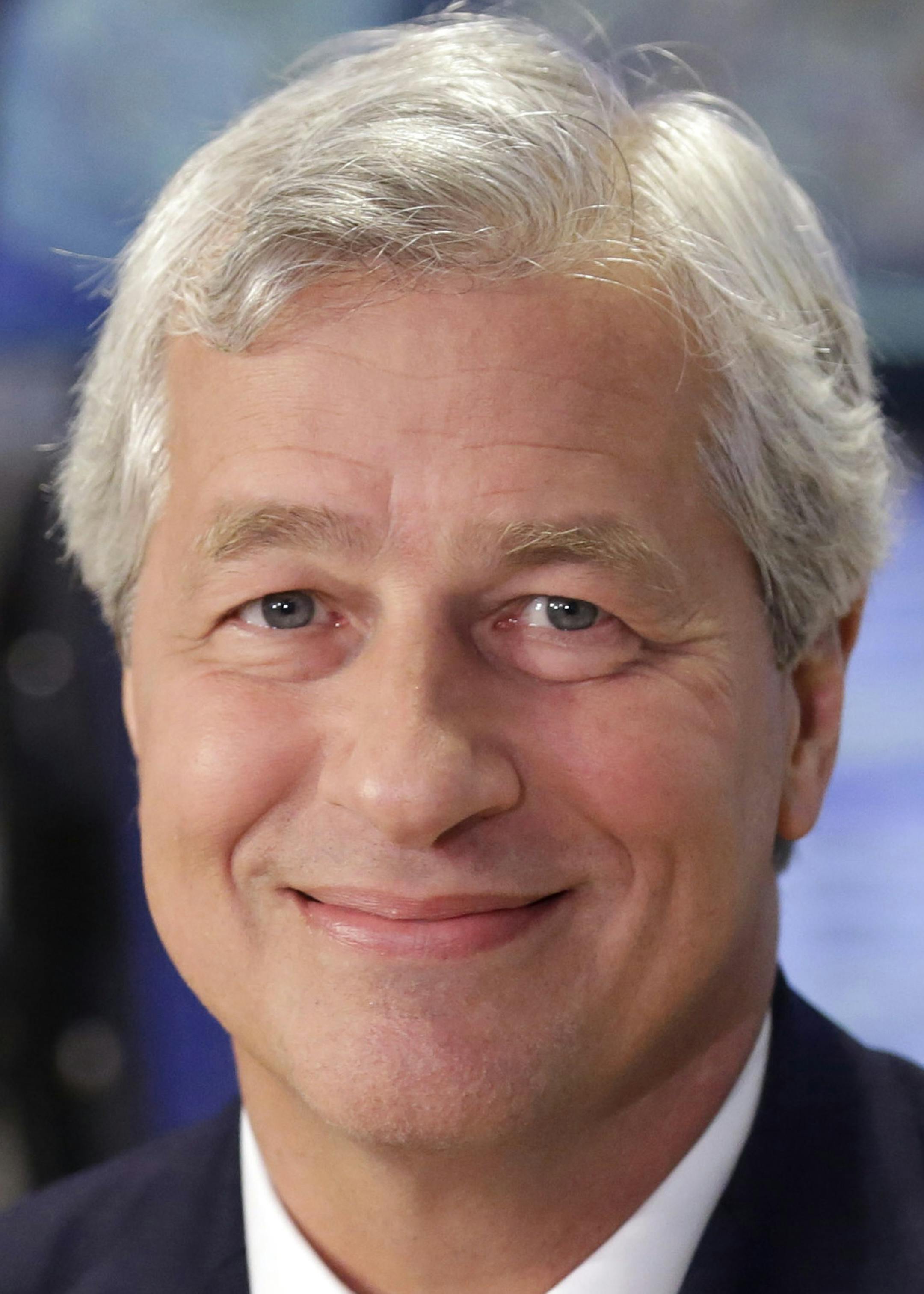 FILE - In this July 12, 2013 file photo, JP Morgan Chase Chairman and CEO Jamie Dimon is interviewed on the floor of the New York Stock Exchange. JPMorgan said Friday, Oct. 25, 2013, that it has agreed to pay $5.1 billion to resolve claims that it misled Fannie Mae and Freddie Mac about risky mortgage securities it sold them before the housing market collapsed. (AP Photo/Richard Drew, File)