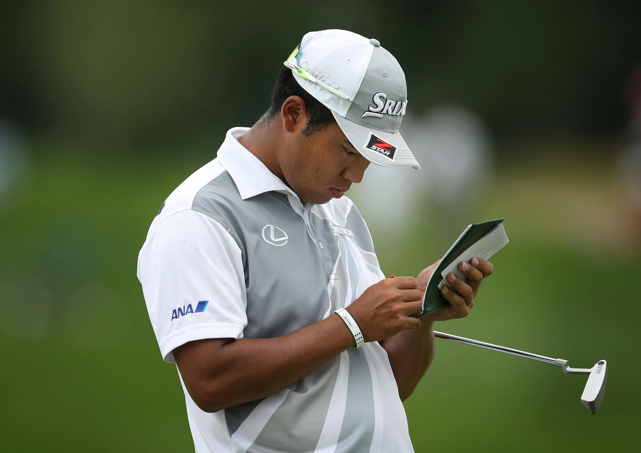 Hideki Matsuyama looked at score card on the 16 green during third round action at TPC Twin Cities Saturday July,6 2019 in Blaine, MN.