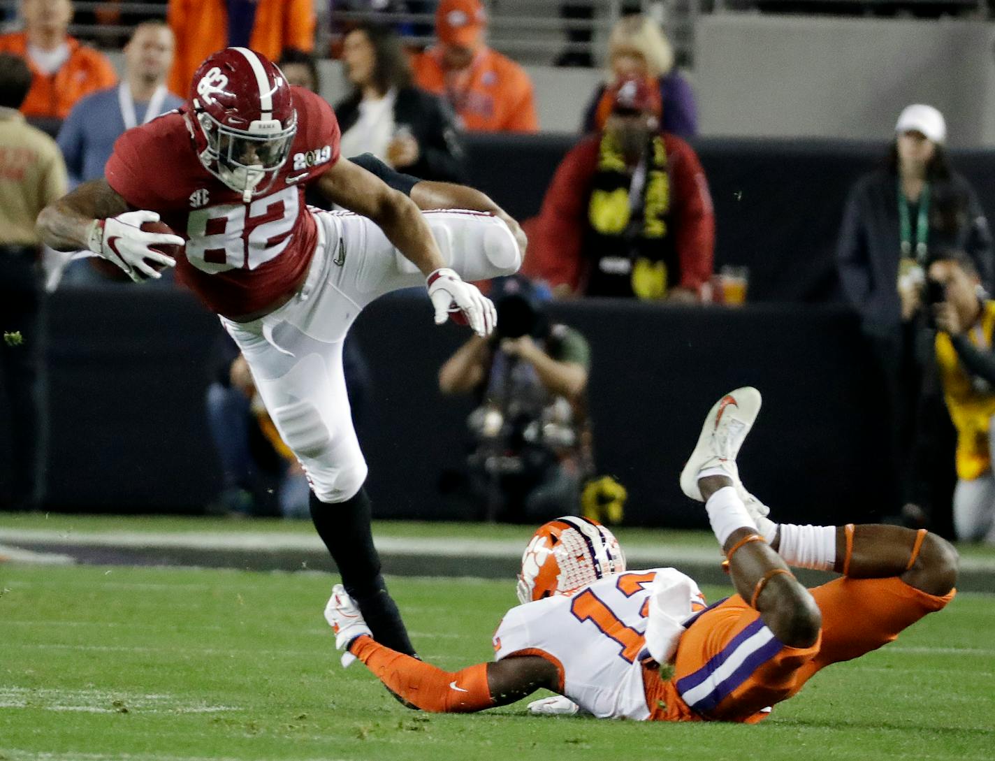 Clemson's K'Von Wallace stops Alabama's Irv Smith Jr. during the first half the NCAA college football playoff championship game, Monday, Jan. 7, 2019, in Santa Clara, Calif. (AP Photo/Chris Carlson)