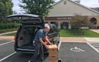 On Thursday, July 20, 2017, Charlie Rodgers, government records specialist at the Minnesota Historical Society, loads 12 boxes of records handed over 
