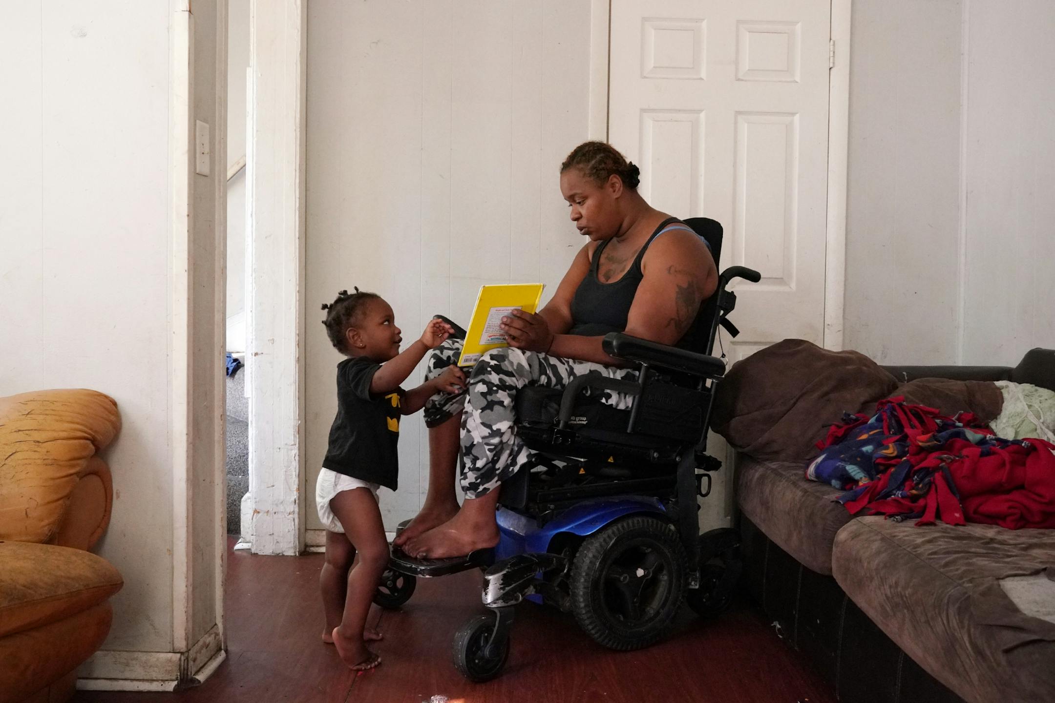 Crystal Deramus played with her son Deprentience Atkins after talking with officers from the St. Paul Police mental health unit about a prior incident with her older daughter.