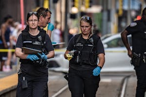 Police investigate a homicide at the 5th and Nicollet Avenue light rail station in Minneapolis, Minn., on Tuesday, Aug. 2, 2022. ] RICHARD TSONG-TAATA