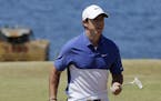 FILE - A Sunday, June 21, 2015 file photo showing Rory McIlroy, of Northern Ireland, walking off the second green during the final round of the U.S. O