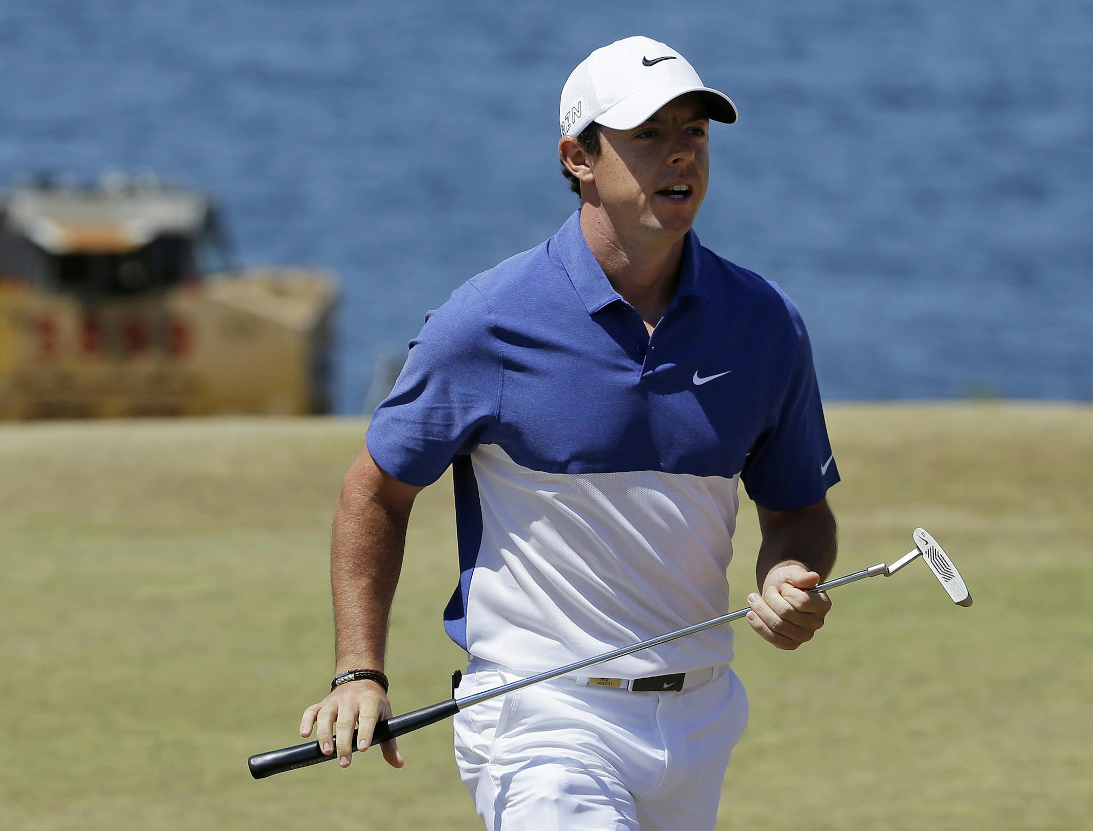 FILE - A Sunday, June 21, 2015 file photo showing Rory McIlroy, of Northern Ireland, walking off the second green during the final round of the U.S. Open golf tournament at Chambers Bay in University Place, Wash. World number one Rory McIlroy has ruptured a ligament in his left ankle while playing soccer less than before the start of his British Open title defense. The Northern Irish golfer gave no indication how long he would be out in the announcement Monday, July 6, 2015, on his Instagram acc