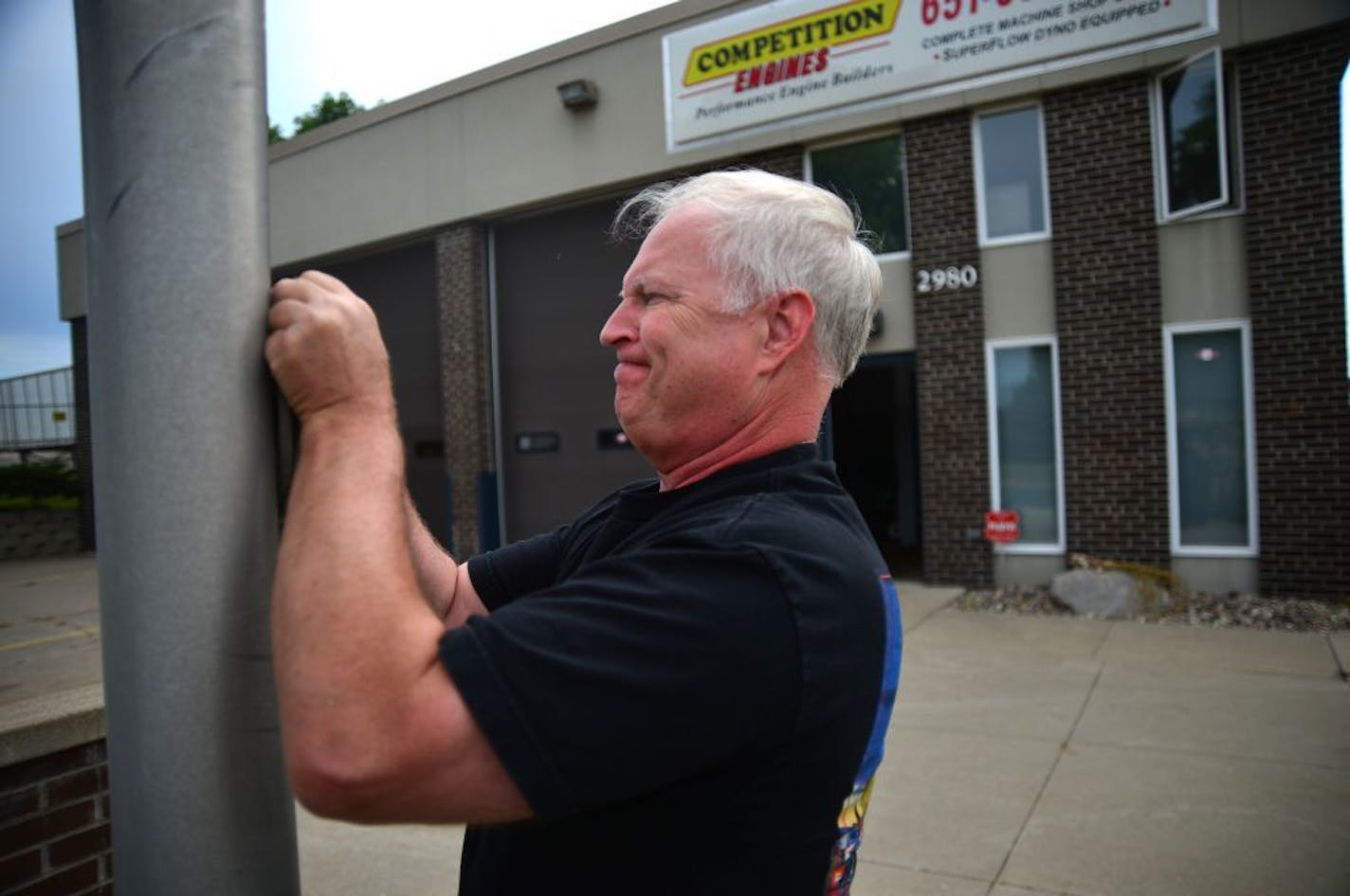 Old fire stations in Minneapolis and St. Paul have found new lives as funky restaurants, theaters and condos, but it's a much different story in the suburbs. Communities that have dealt with unloading old stations haven't found it easy to get them on the tax rolls. Randy Quam has taken over this old Eagan fire station and has based has Competition Engines business there. Every morning he hoists the American flag in front of the old fire house.